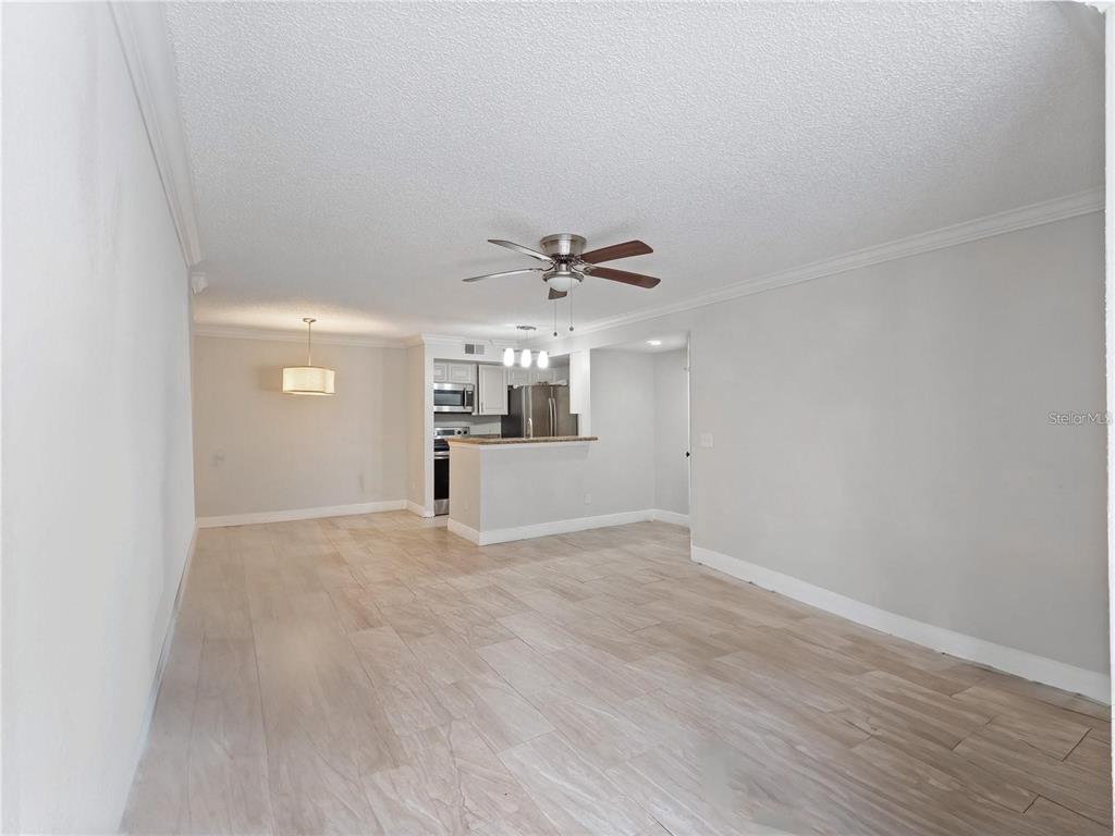 5144 Conroy Road, Unit 27 Orlando, FL 32811 - Photo 4 of 20 a view of an empty room with a window