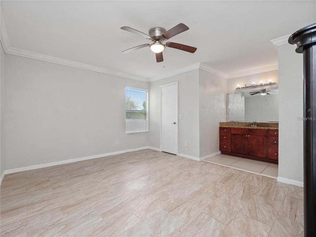 5144 Conroy Road, Unit 27 Orlando, FL 32811 - Photo 9 of 20 an empty room with closet and windows