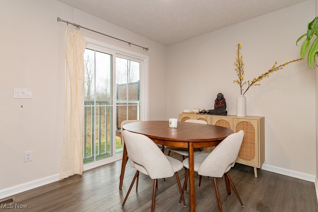 192 Raintree Lane Painesville, OH 44077 - Photo 10 of 23 Dining area featuring dark wood-type flooring