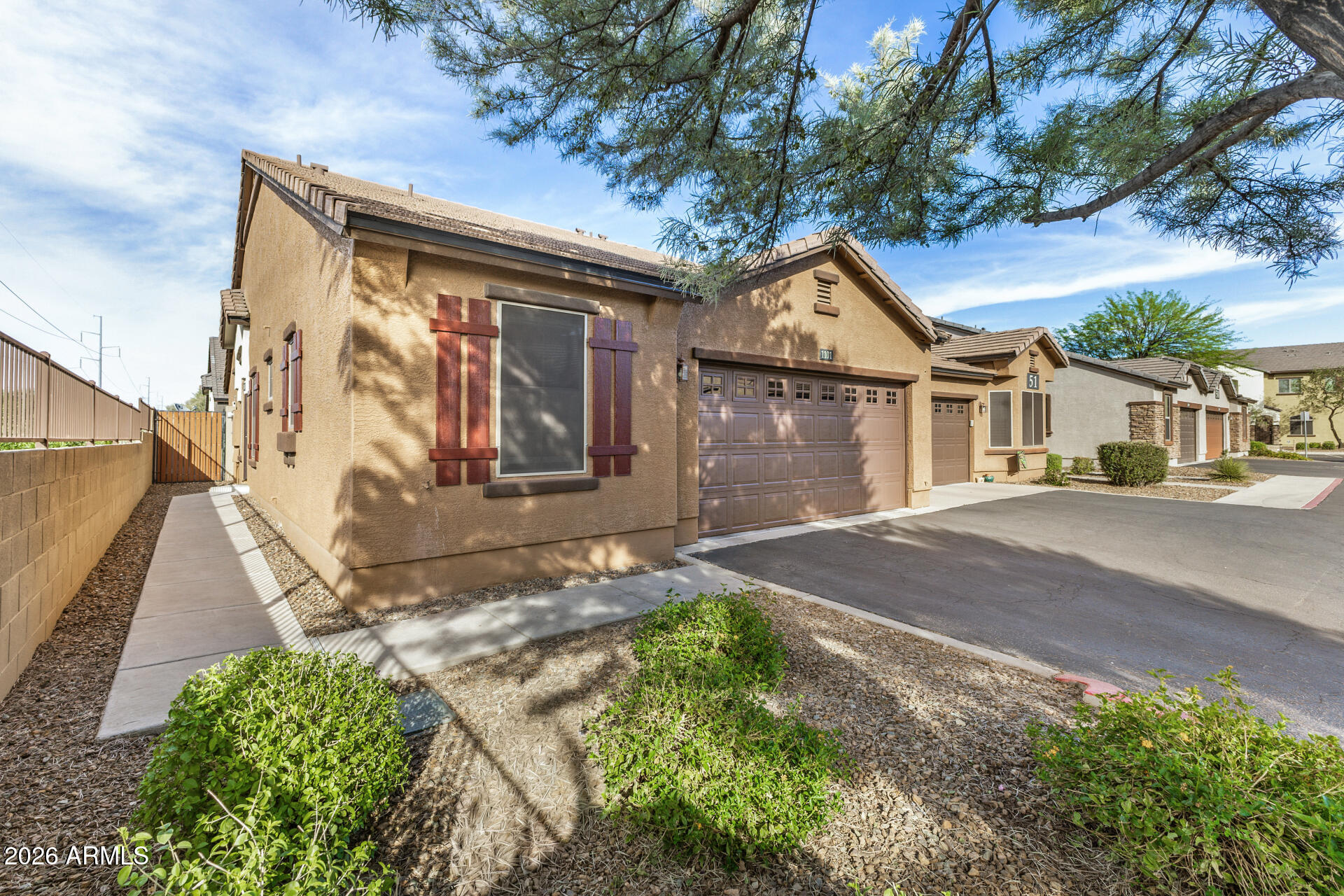 2725 East Mine Creek Road, Unit 1101 Phoenix, AZ 85024 - Photo 3 of 43 a front view of a house with garden