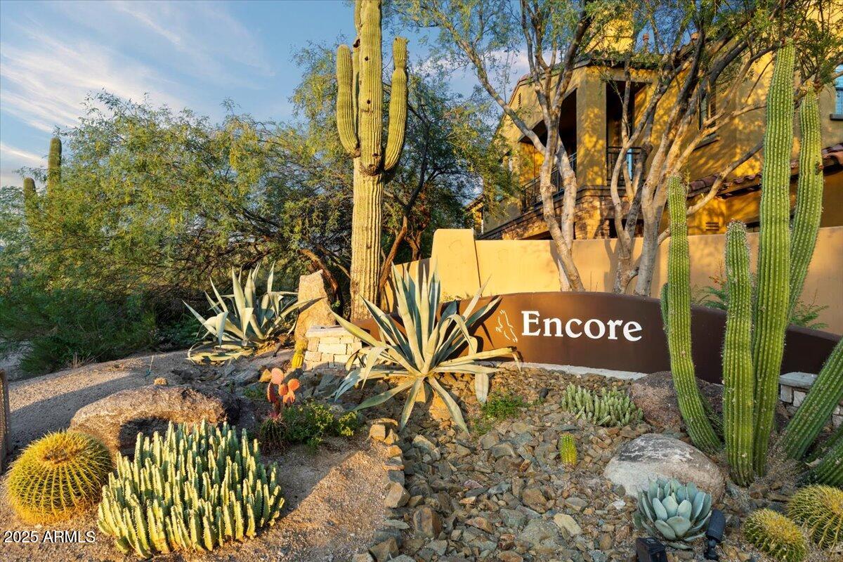 a sign that is sitting on a brick wall