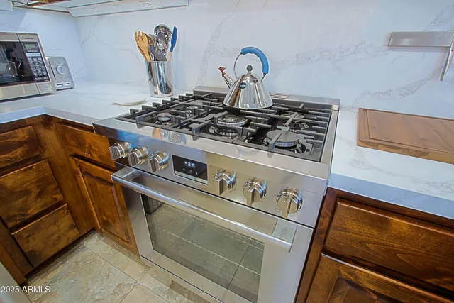 a view of a room with shelves and wooden floor