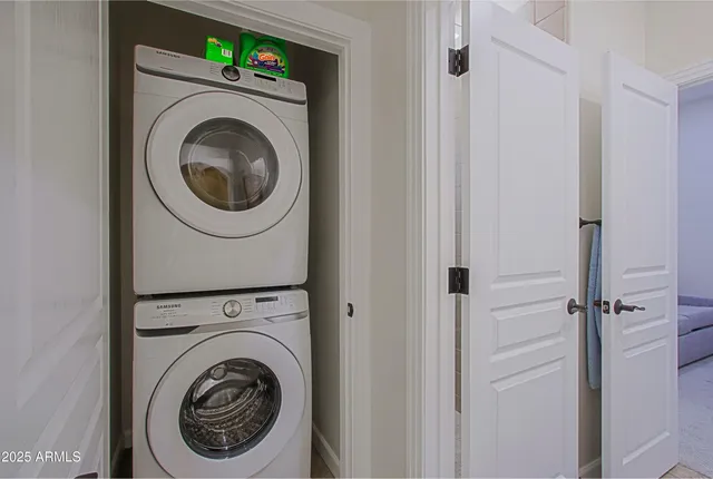 a living room with a flat screen tv and a floor to ceiling window