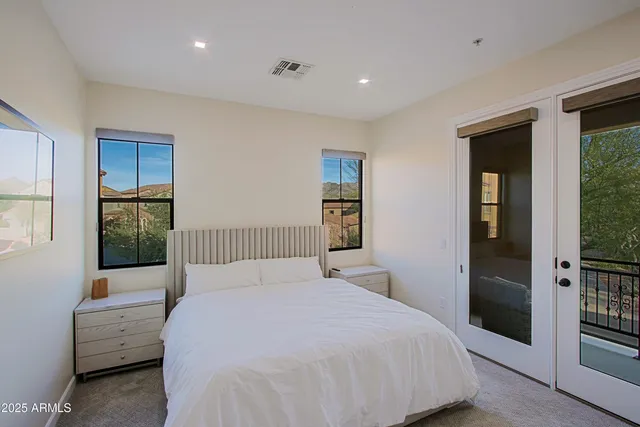 a bedroom with furniture and a window
