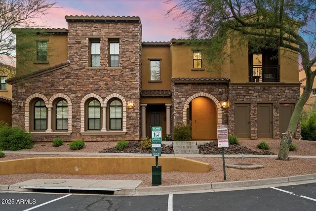a kitchen with kitchen island a stove and a refrigerator