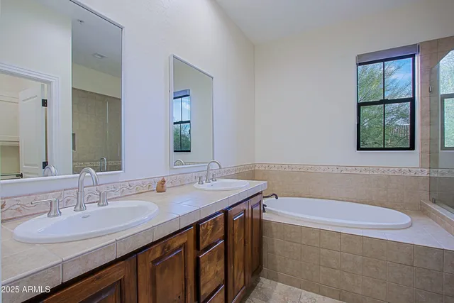 a bathroom with a shower and bathtub