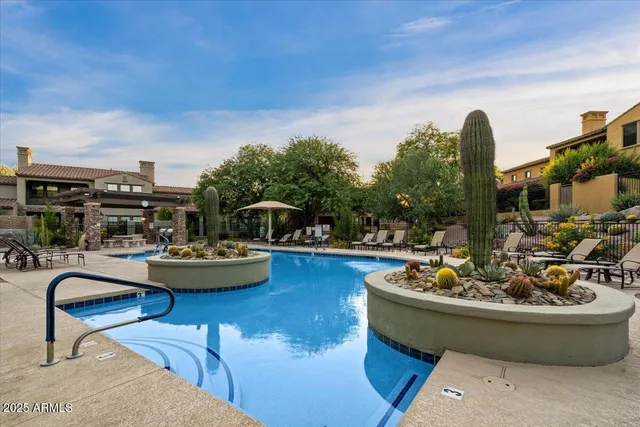 an aerial view of residential house with outdoor space and trees