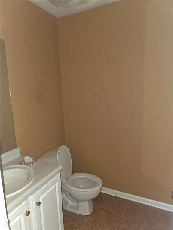 4410 Cross Lane Decatur, GA 30035 - Photo 11 of 26 a white toilet sitting next to a white sink and vanity