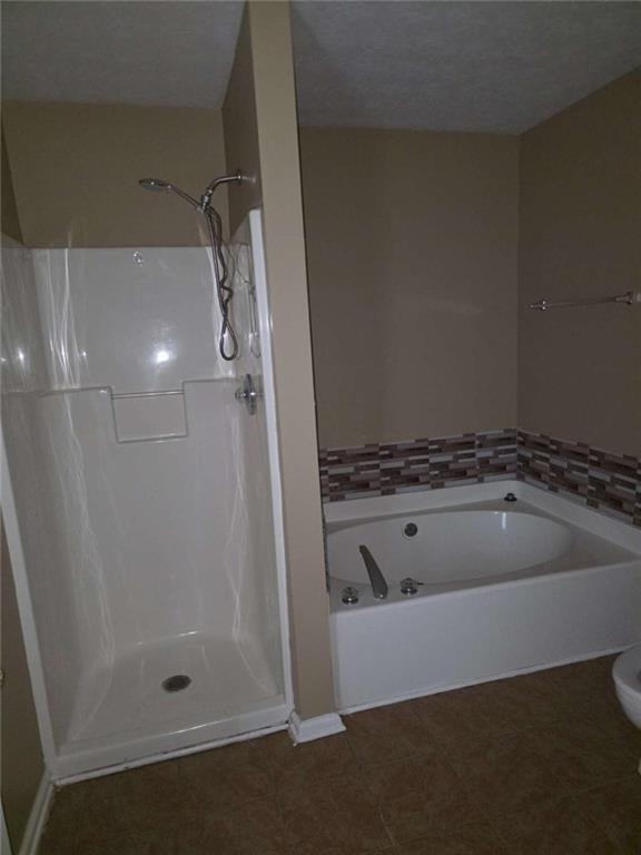 4410 Cross Lane Decatur, GA 30035 - Photo 19 of 26 a bathroom with a tub and shower
