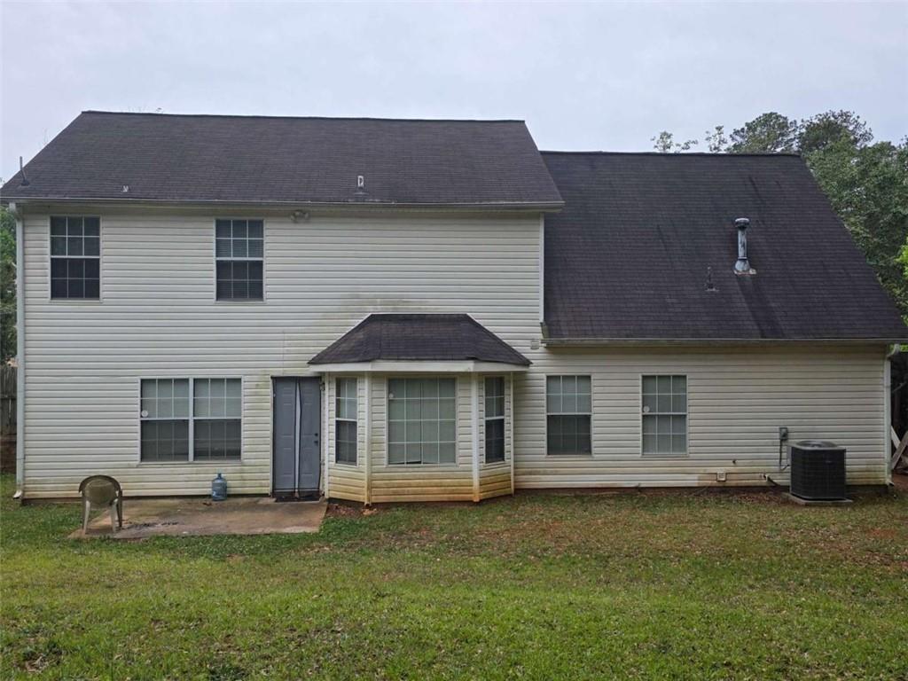 4410 Cross Lane Decatur, GA 30035 - Photo 2 of 26 a front view of a house with a garden and yard