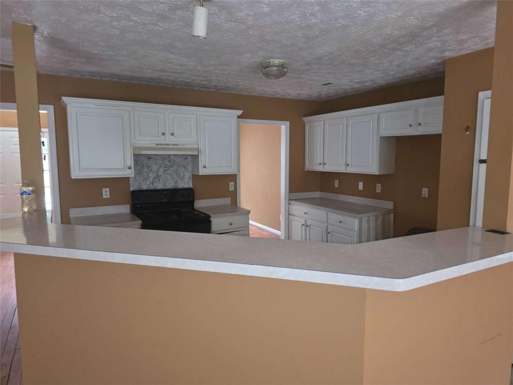 4410 Cross Lane Decatur, GA 30035 - Photo 6 of 26 a kitchen with stainless steel appliances a refrigerator and a stove