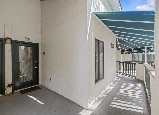 a view of a livingroom with stairs and furniture