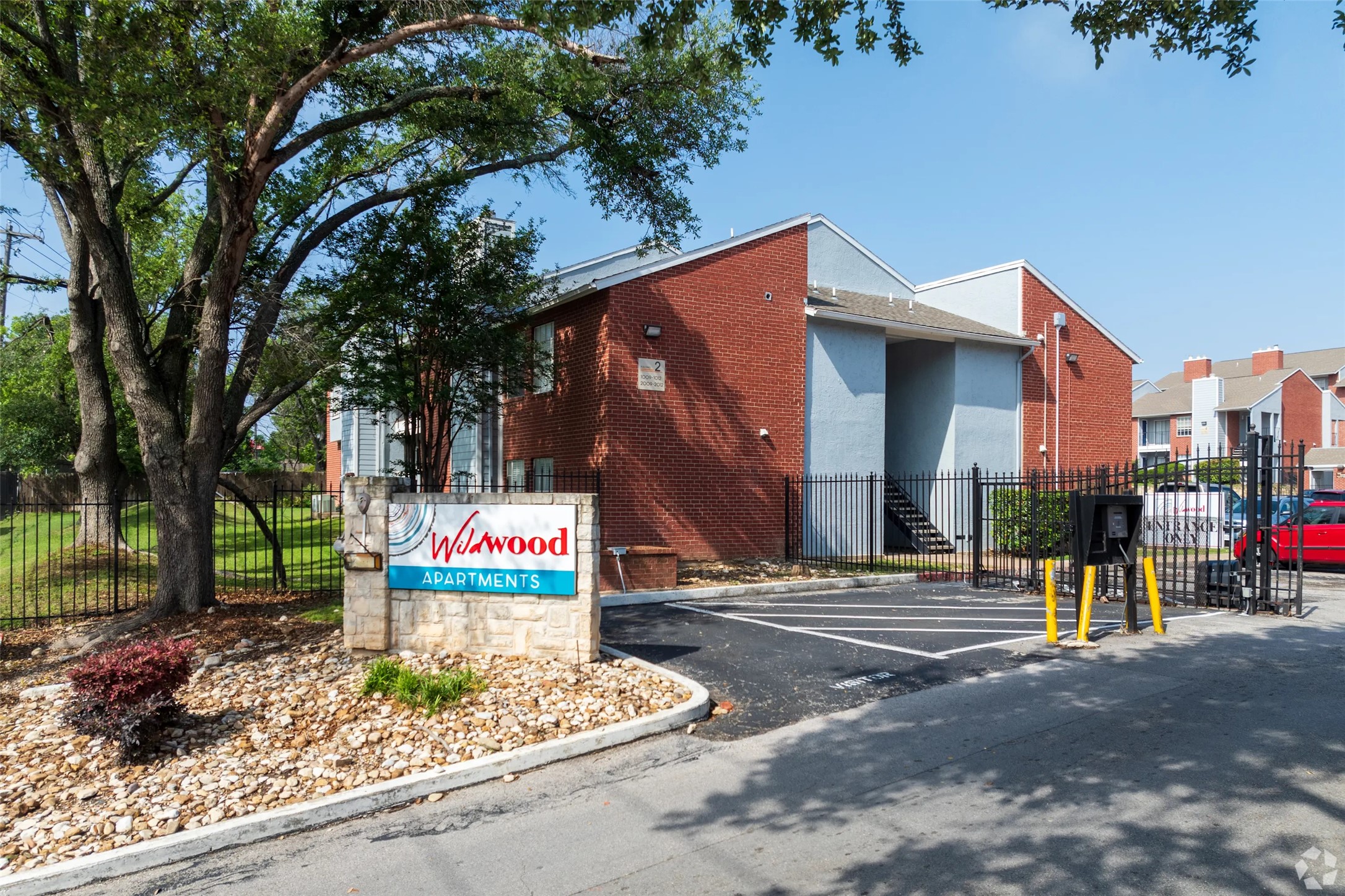 7610 Cameron Road, Unit 2065 Austin, TX 78752 - Photo 17 of 42 a view of street with an entrance and trees