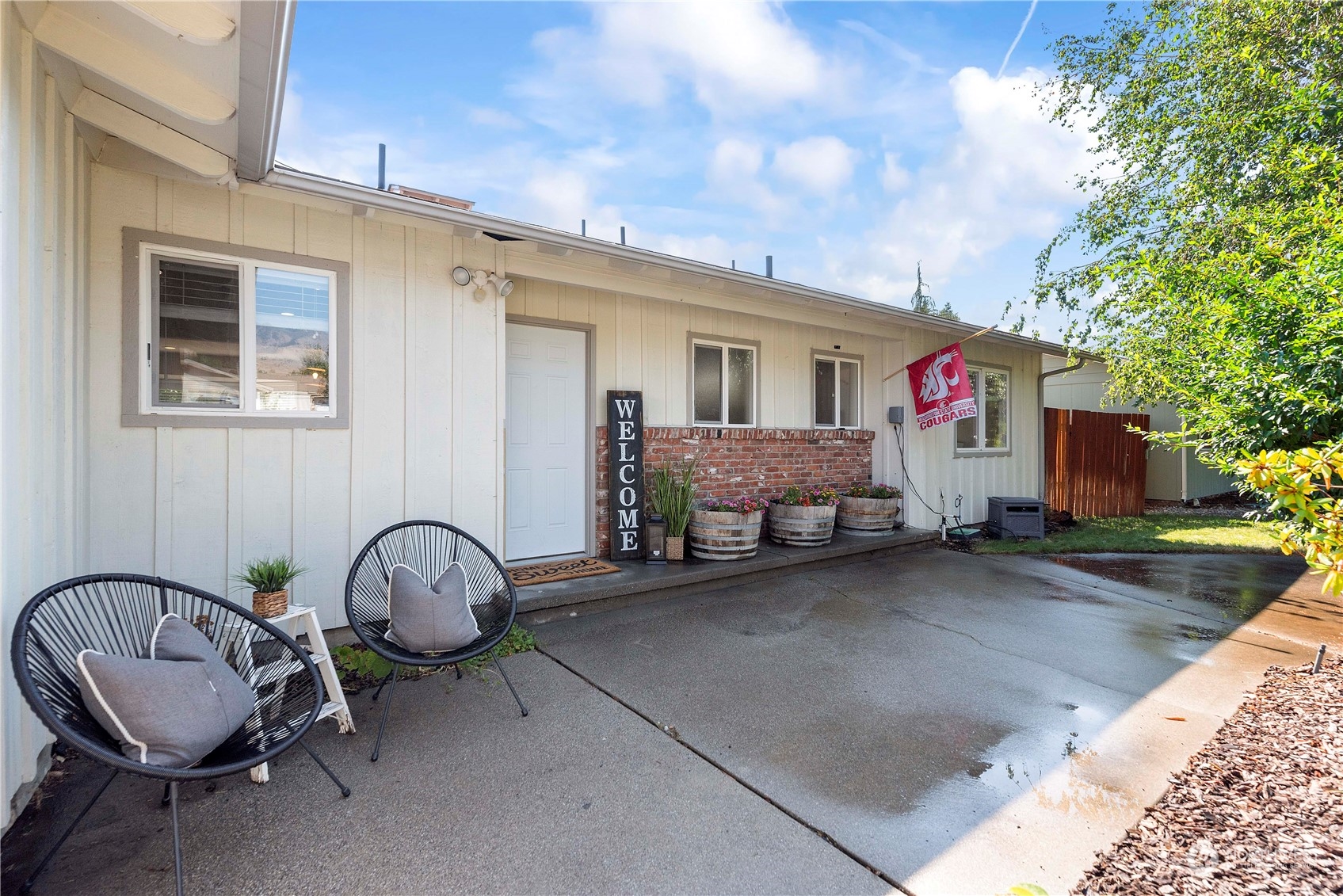 403 Marilyn Avenue Wenatchee, WA 98801 - Photo 1 of 24 a view of a backyard with table and chairs