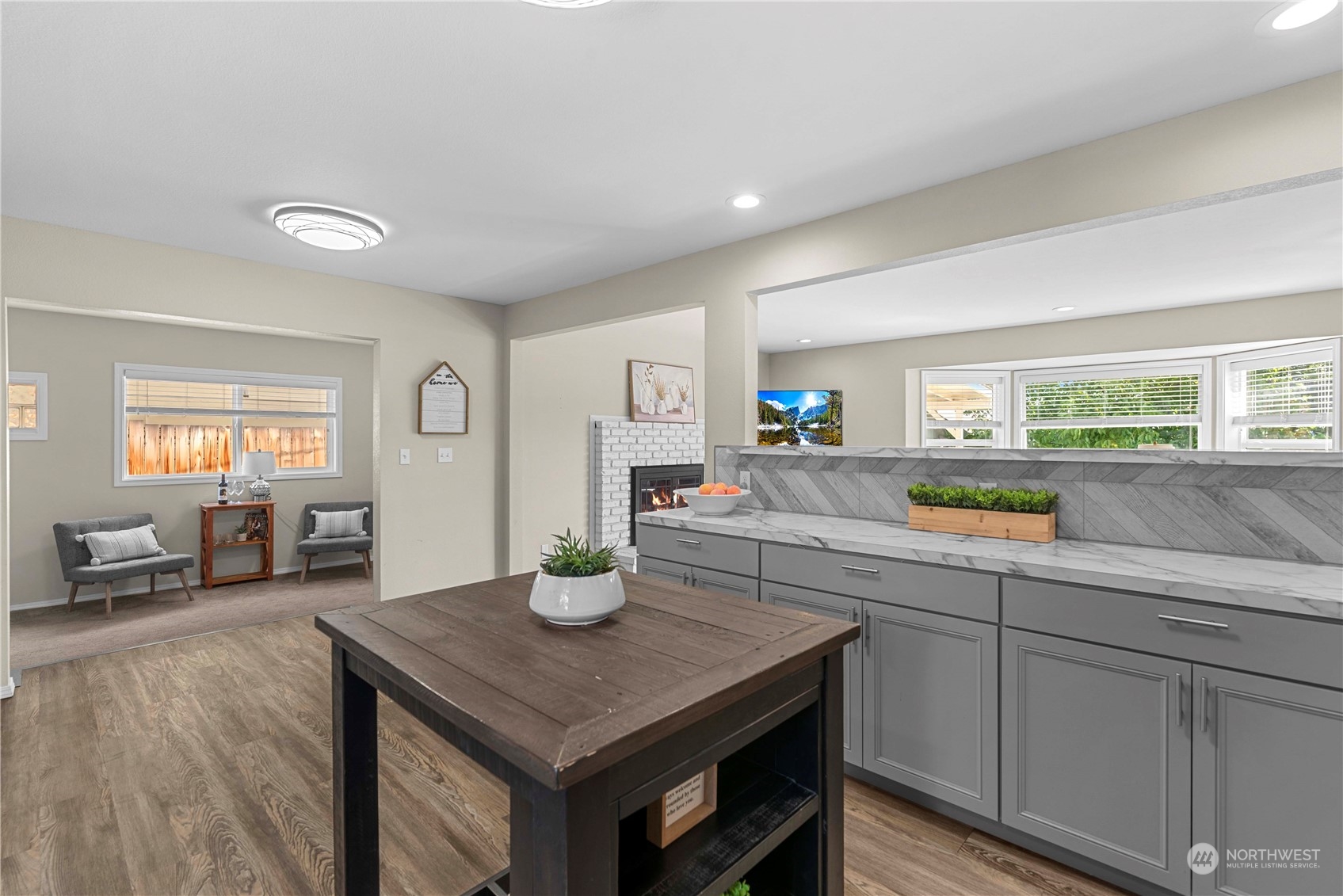 403 Marilyn Avenue Wenatchee, WA 98801 - Photo 11 of 24 a kitchen with a sink cabinets and wooden floor