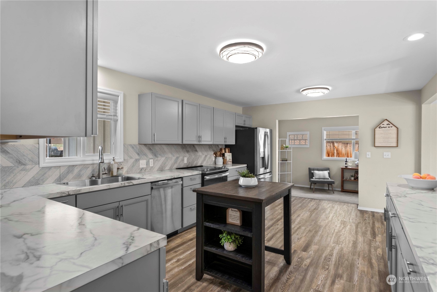 403 Marilyn Avenue Wenatchee, WA 98801 - Photo 13 of 24 a kitchen with a sink stove and cabinets
