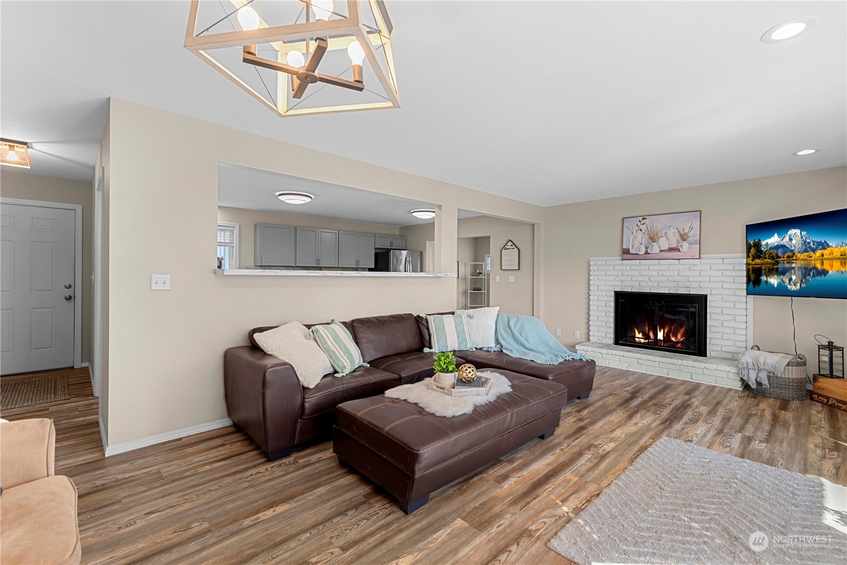 403 Marilyn Avenue Wenatchee, WA 98801 - Photo 5 of 24 a living room with furniture and a fireplace