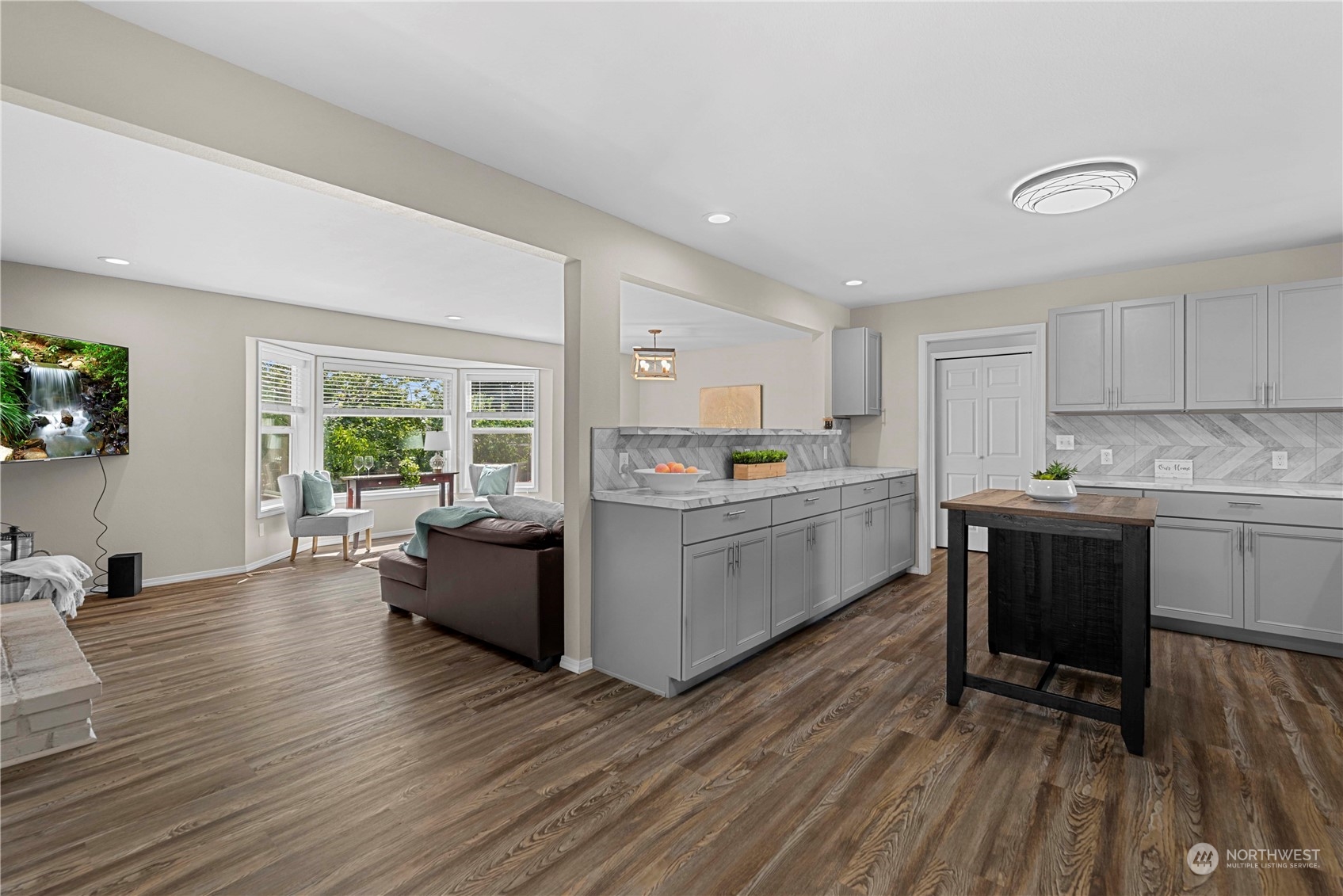 403 Marilyn Avenue Wenatchee, WA 98801 - Photo 10 of 24 a kitchen with a white cabinets and wooden floor
