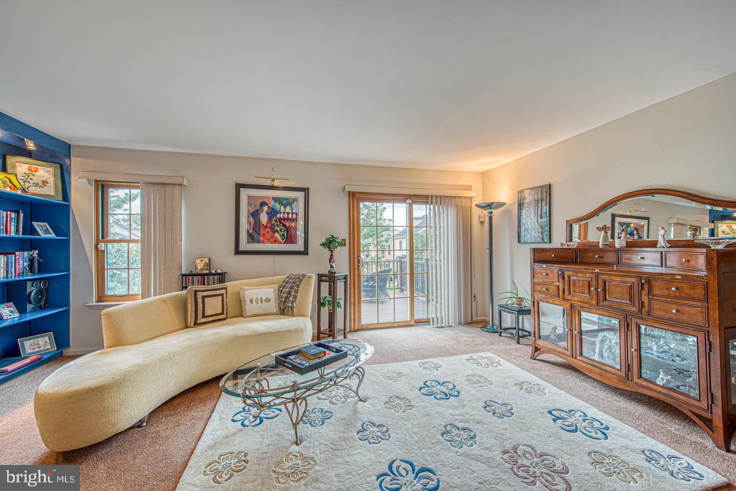 333 Scola Road Brookhaven, PA 19015 - Photo 22 of 57 a living room with furniture a bookshelf and a window