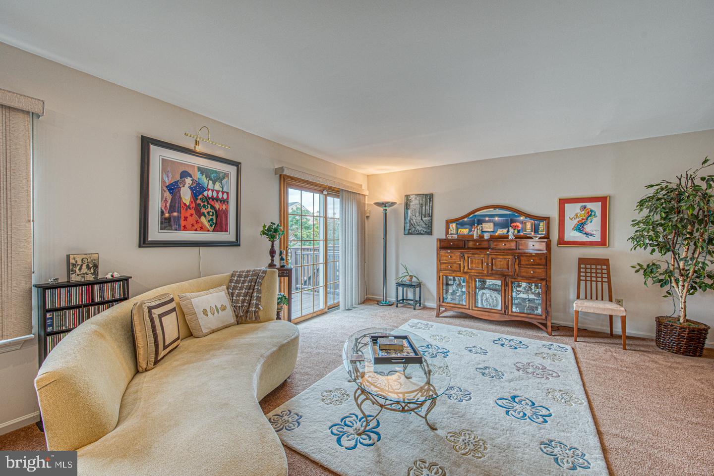333 Scola Road Brookhaven, PA 19015 - Photo 23 of 57 a living room with furniture a rug a fireplace and a large window