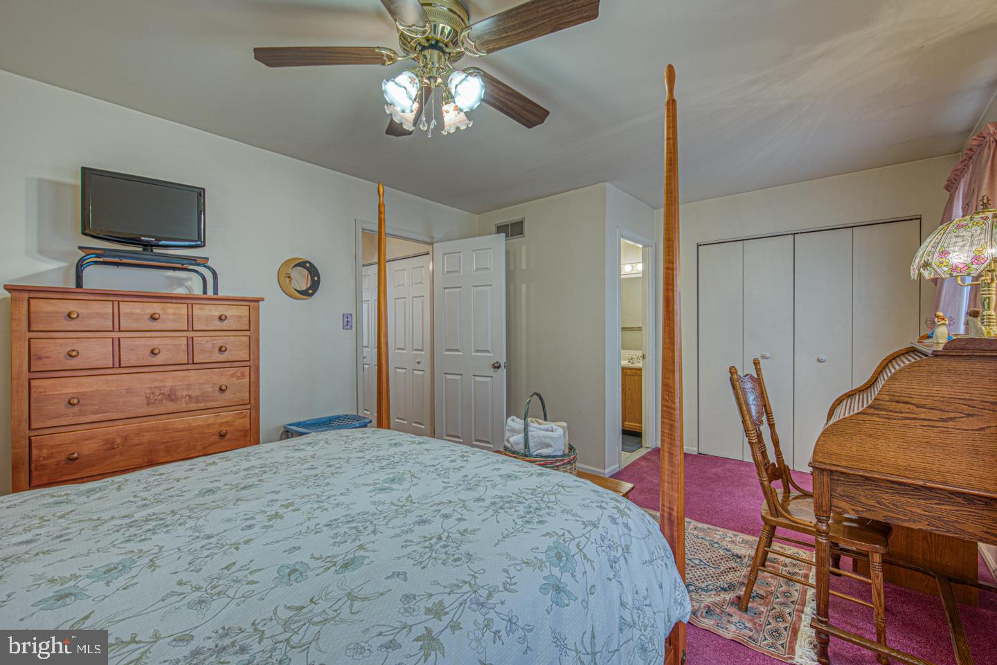333 Scola Road Brookhaven, PA 19015 - Photo 34 of 57 a bedroom with a bed and a flat tv screen on dresser