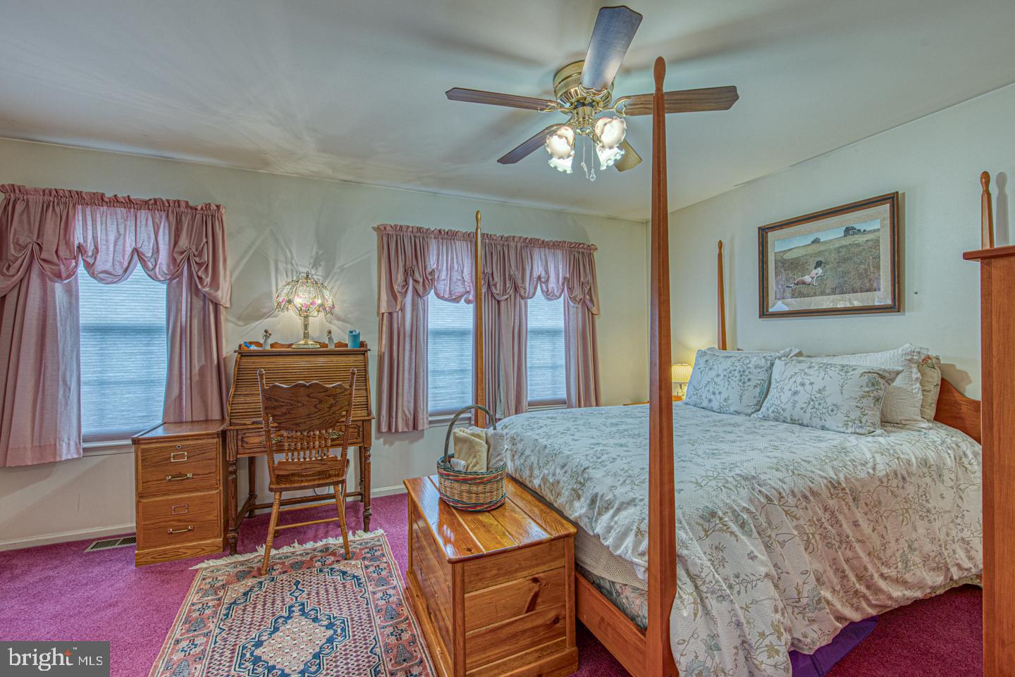 333 Scola Road Brookhaven, PA 19015 - Photo 35 of 57 a bedroom with a bed and dresser with mirror