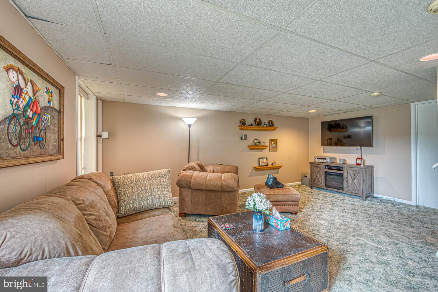 333 Scola Road Brookhaven, PA 19015 - Photo 40 of 57 a living room with furniture and a flat screen tv