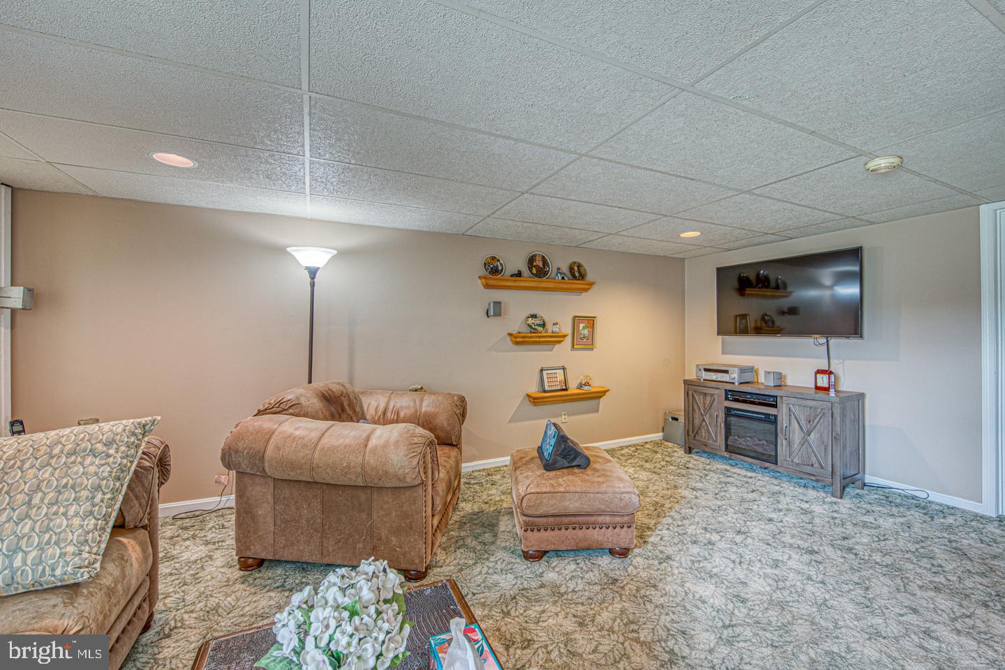 333 Scola Road Brookhaven, PA 19015 - Photo 42 of 57 a living room with furniture and a flat screen tv