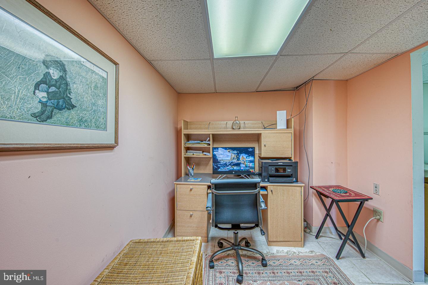 333 Scola Road Brookhaven, PA 19015 - Photo 46 of 57 a room with furniture a rug and a painting