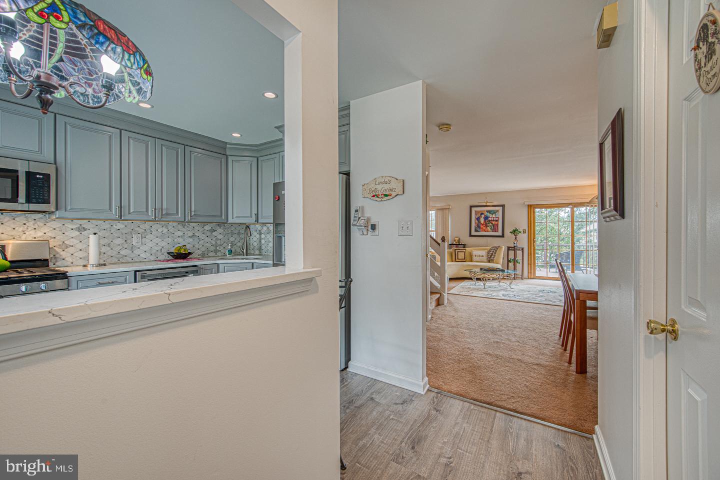 333 Scola Road Brookhaven, PA 19015 - Photo 7 of 57 a kitchen with stainless steel appliances granite countertop a refrigerator and a sink