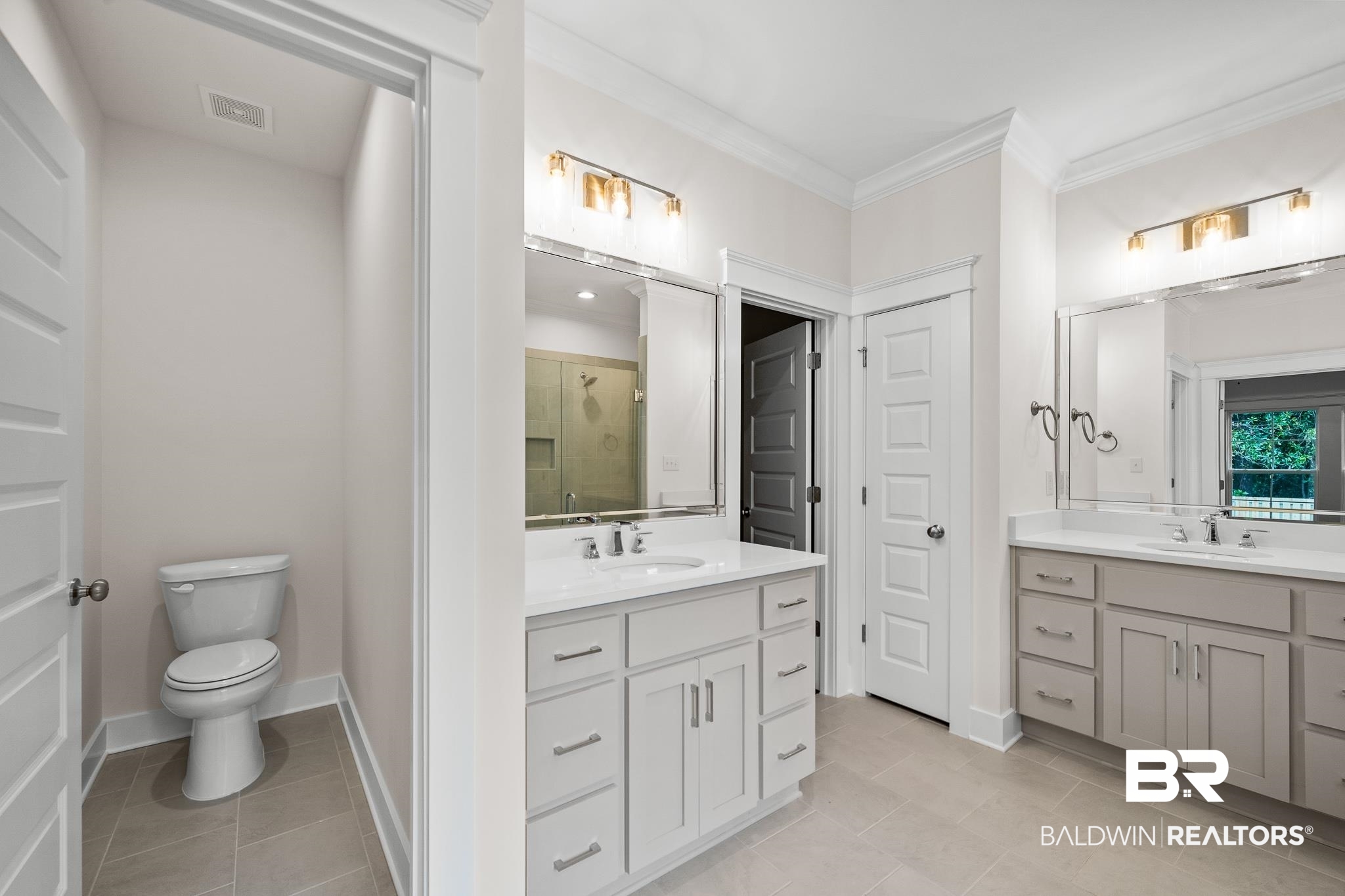 29 Signal Hill Road Daphne, AL 36527 - Photo 22 of 36 Bathroom featuring tile patterned floors, vanity, toilet, a shower with shower door, and ornamental molding