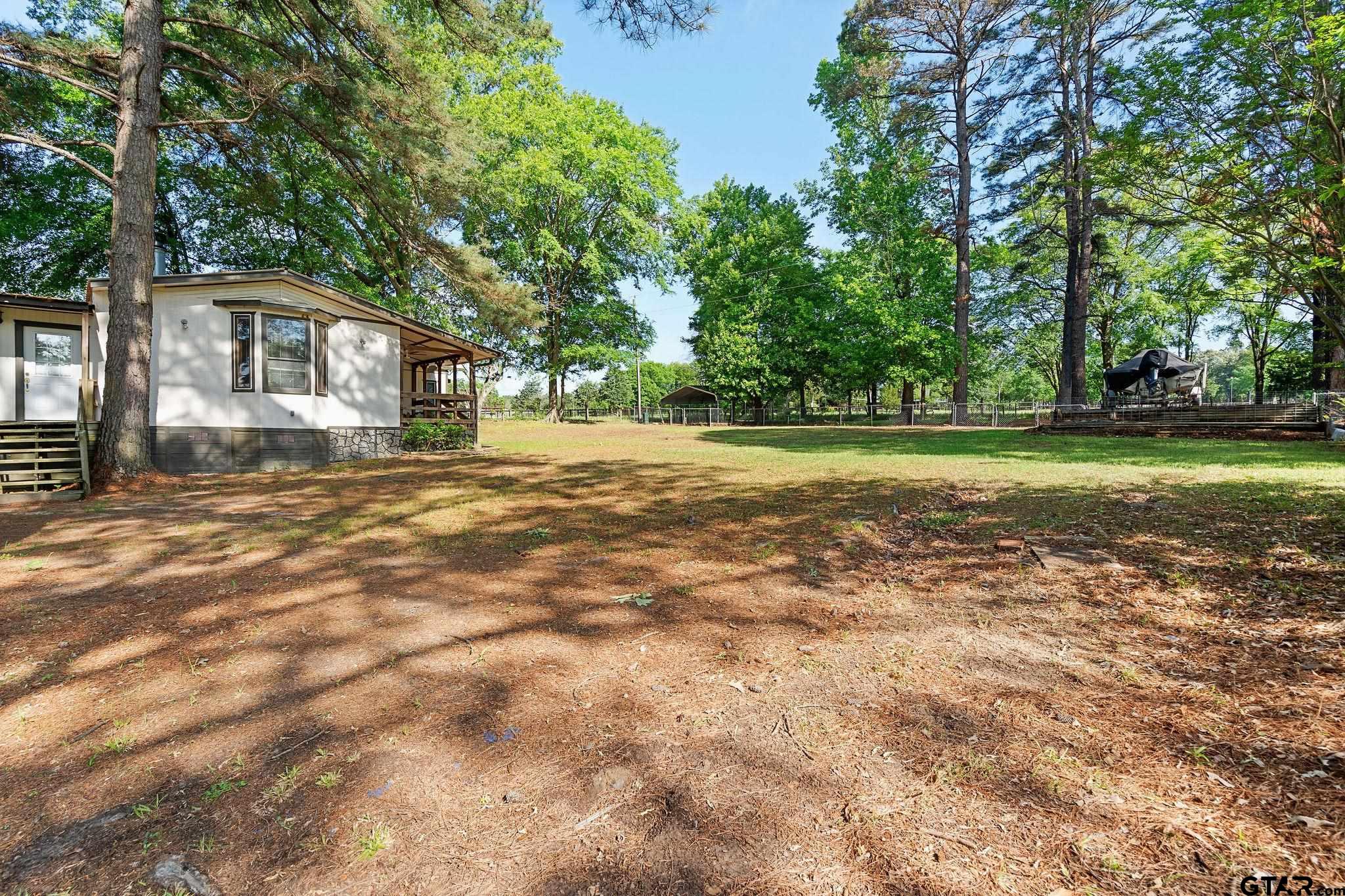 4550 Crabapple Road Gilmer, TX 75645 - Photo 31 of 33 a view of a yard in front of a house