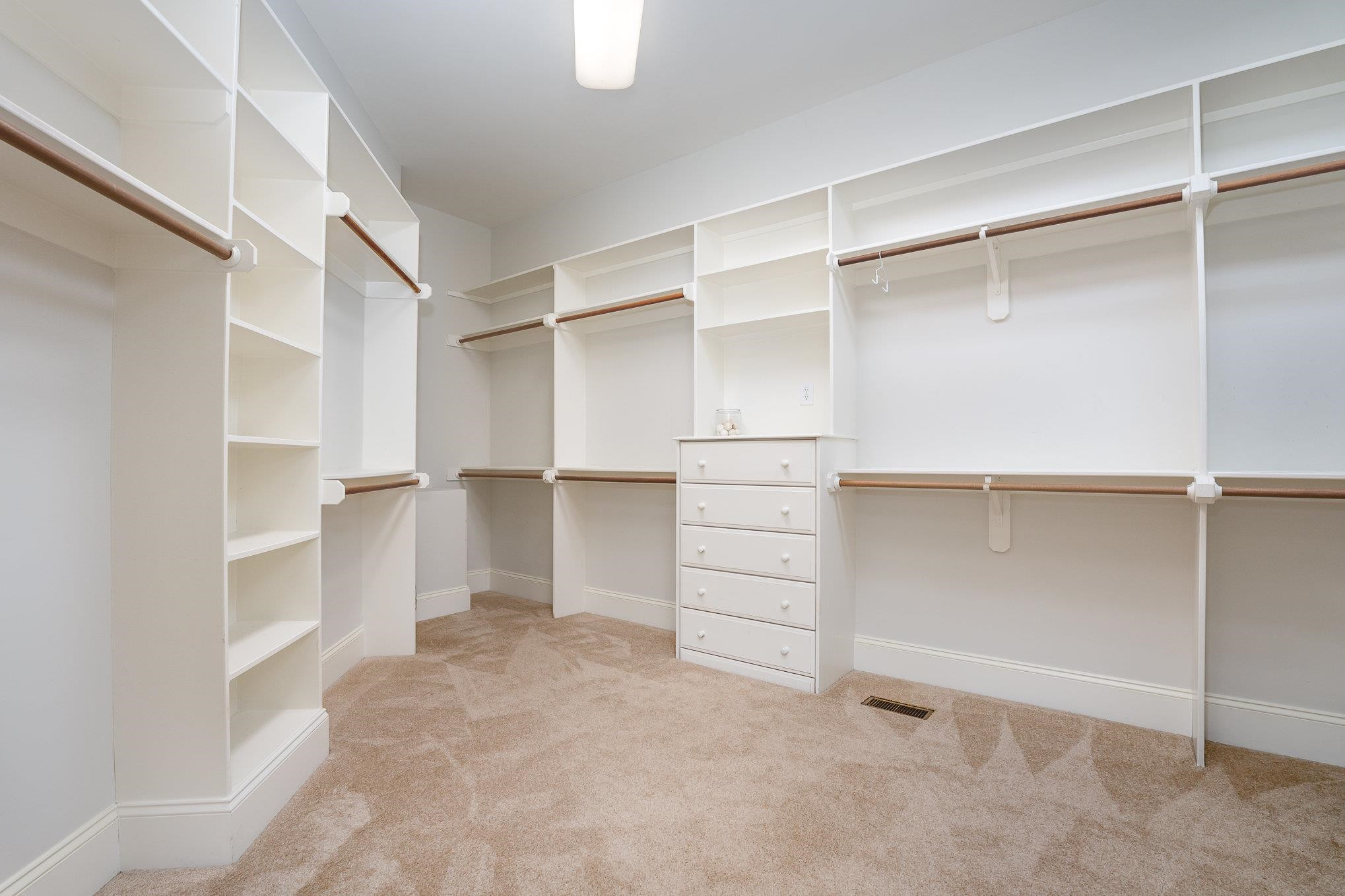 1817 Silver Mist Court Raleigh, NC 27613 - Photo 19 of 40 a view of walk in closet with empty racks