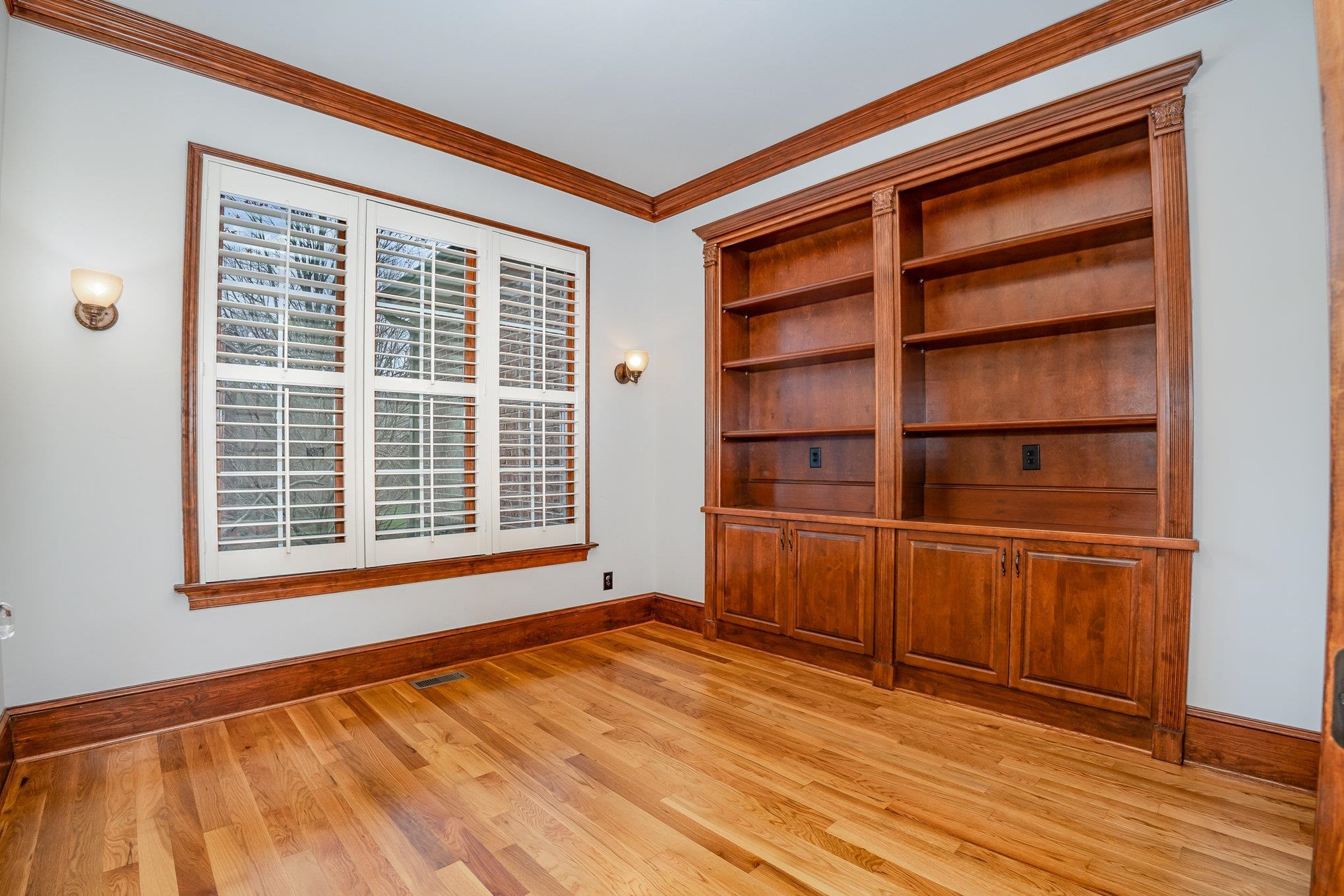 1817 Silver Mist Court Raleigh, NC 27613 - Photo 7 of 40 a view of an empty room with wooden floor and a window