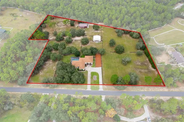 a view of a house with a swimming pool