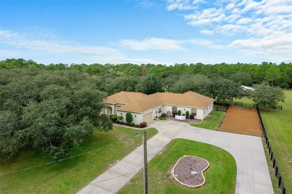 a view of a dining room with furniture wooden floor and chandelier