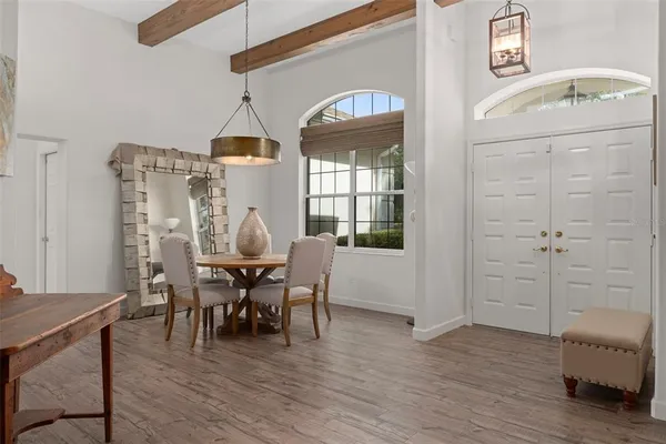 a view of a dining room with furniture window and wooden floor
