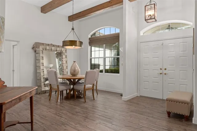 a view of a dining room with furniture window and wooden floor