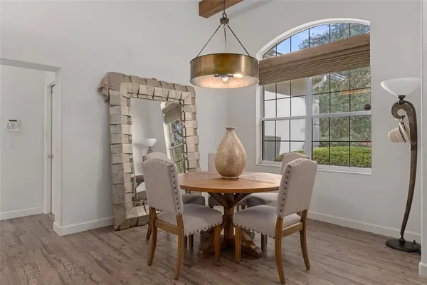 a kitchen with stainless steel appliances granite countertop a stove refrigerator and cabinets