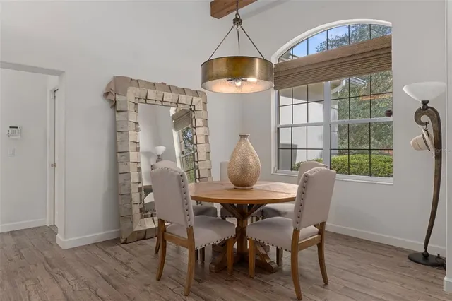 a kitchen with stainless steel appliances granite countertop a stove refrigerator and cabinets