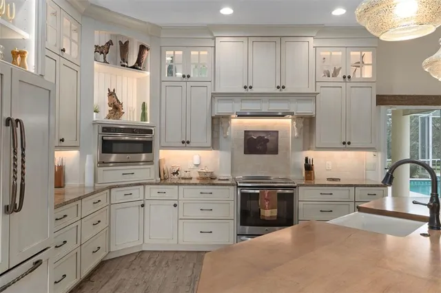 a view of living room with granite countertop furniture and wooden floor