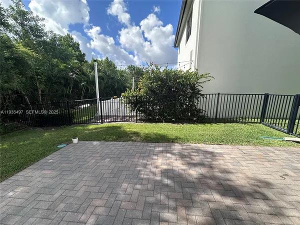 a view of backyard with garden and entertaining space