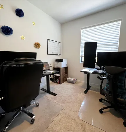 a view of workspace with wooden floor windows