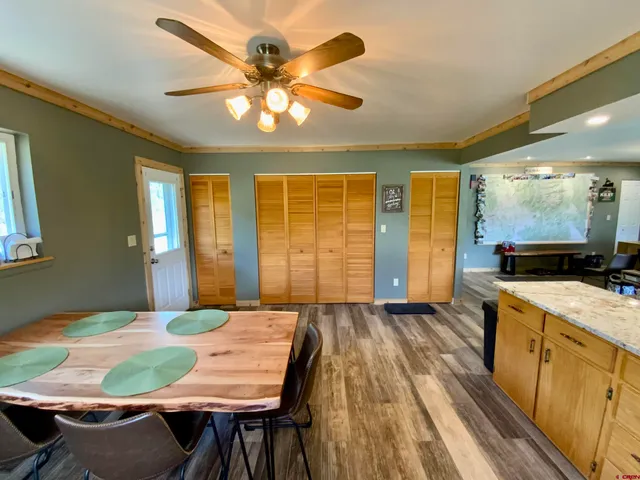 a view of a livingroom with furniture window and wooden floor