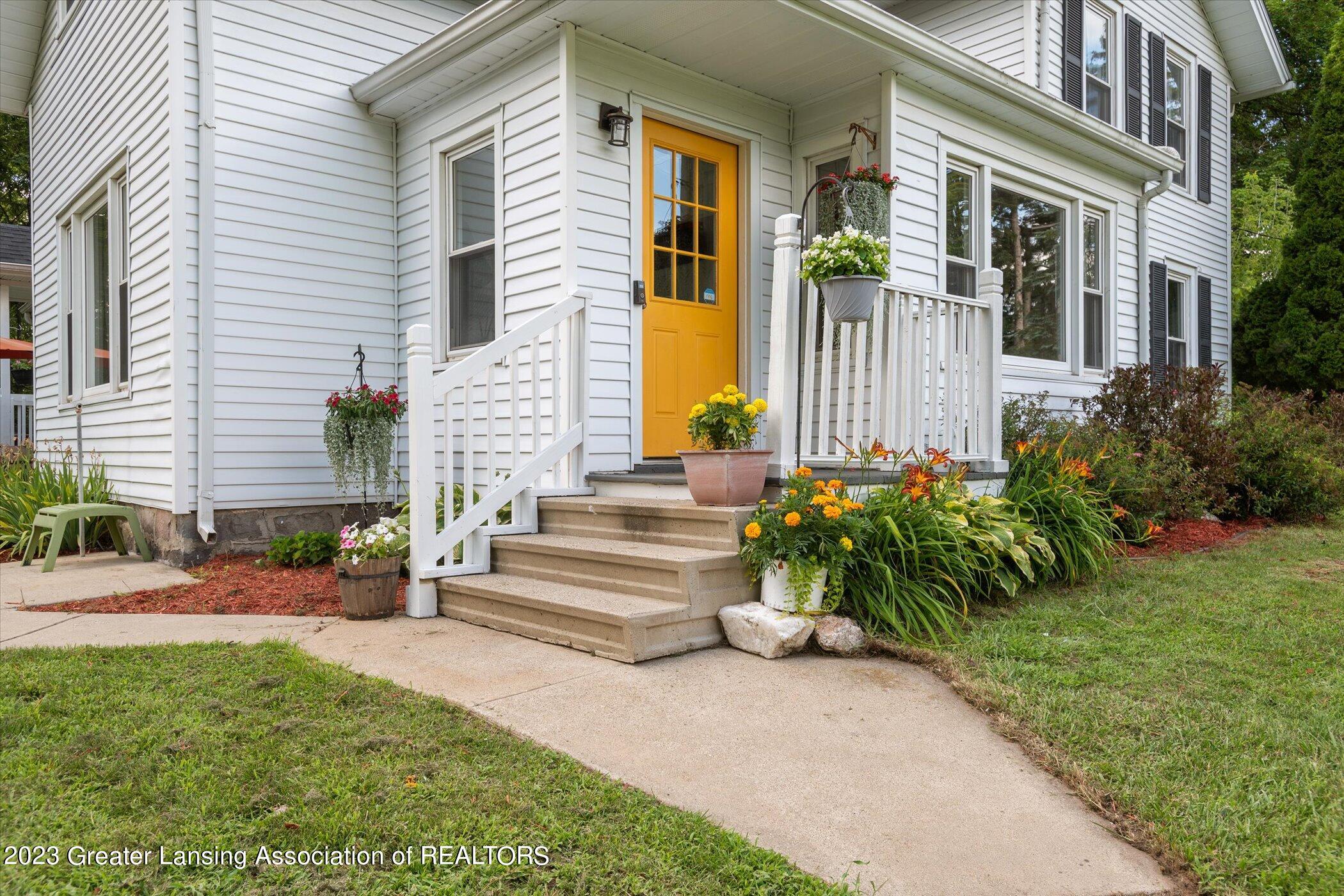 16168 Center Road East Lansing, MI 48823 - Photo 2 of 38 Inviting Porch