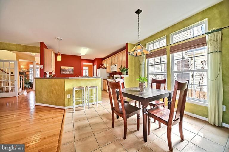 18404 Cornflower Road Boyds, MD 20841 - Photo 14 of 30 a dining room with furniture and wooden floor