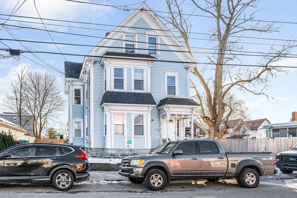 339 Lincoln Street, Unit 2 Lowell, MA 01852 - Photo 18 of 18 a car parked in front of a building