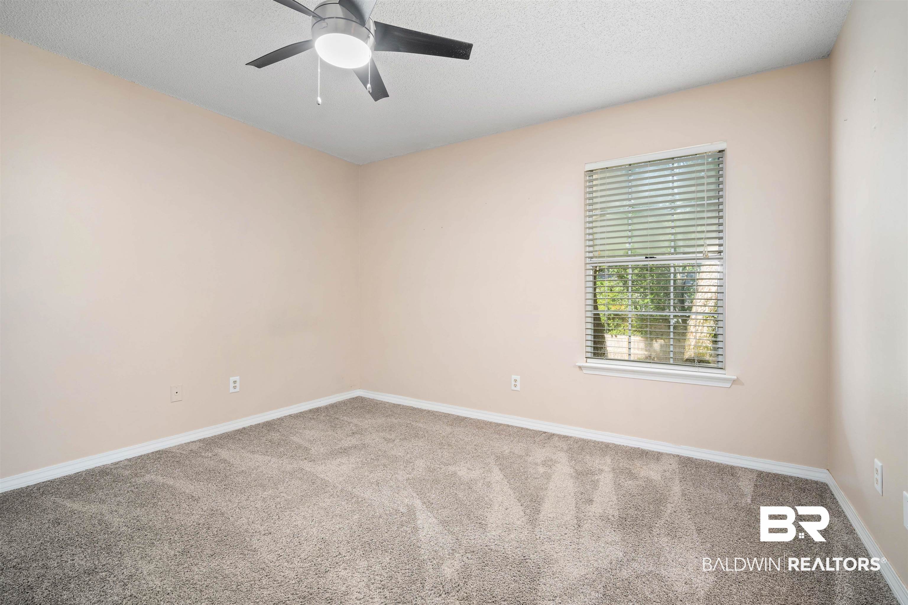 804 Wildwood Avenue Mobile, AL 36609 - Photo 21 of 30 Carpeted empty room featuring a textured ceiling and ceiling fan