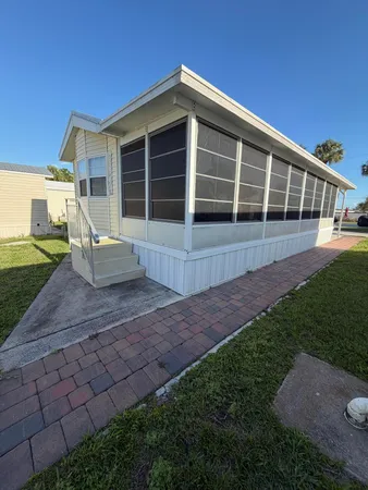 a view of a house with backyard