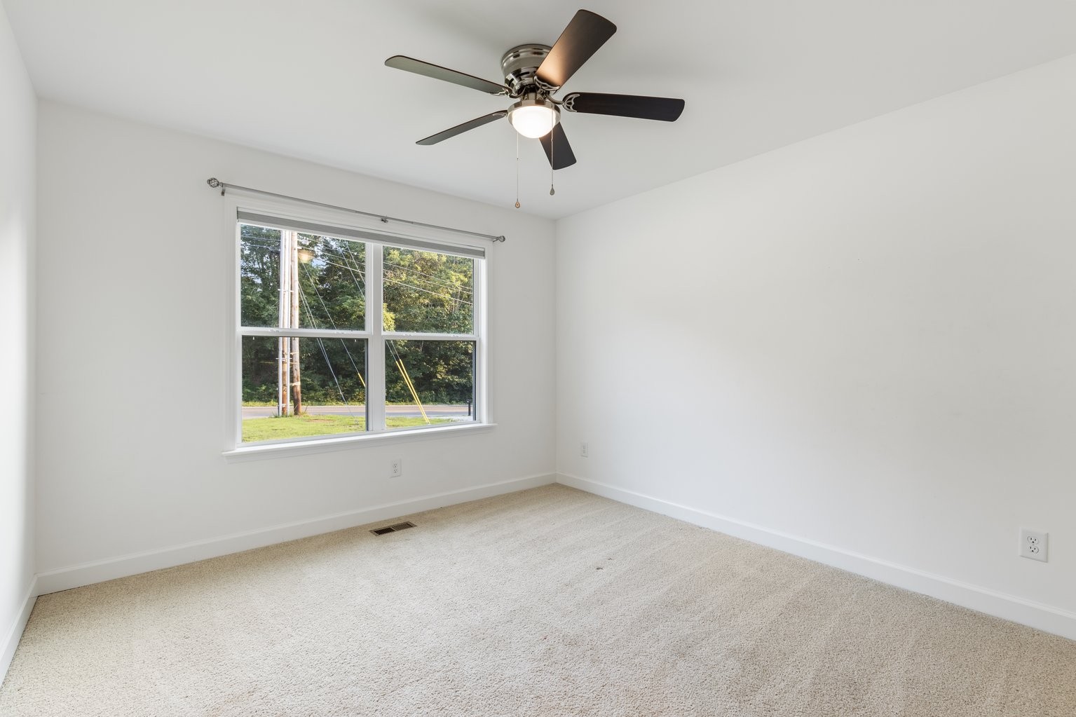 10580 Church Road Bon Aqua, TN 37025 - Photo 18 of 29 an empty room with a window and a fan